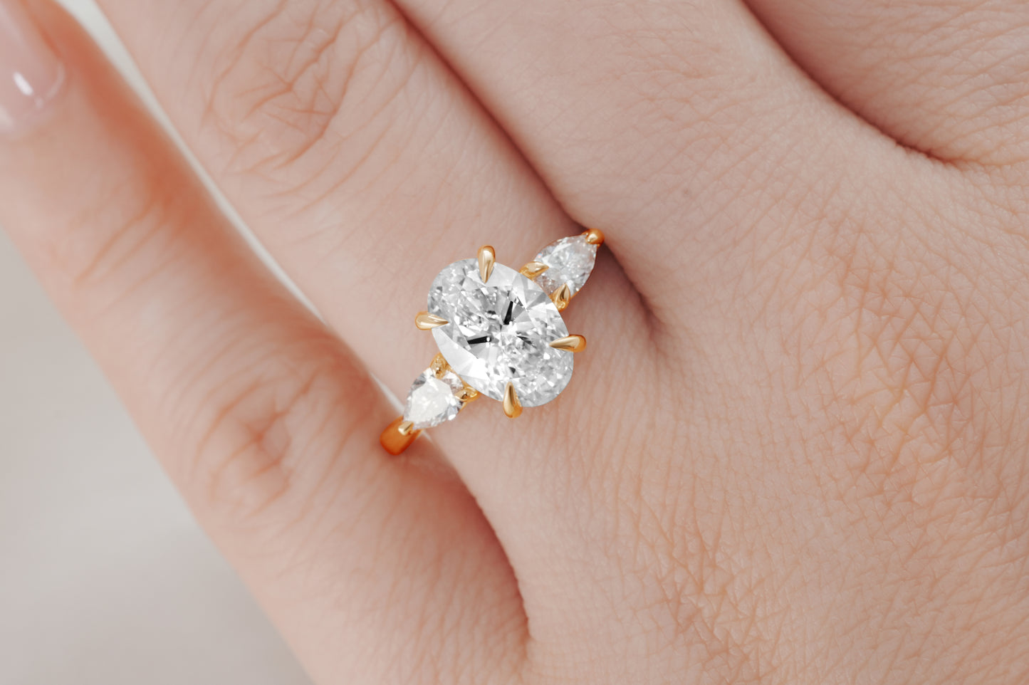 Oval and Pear Diamond Three Stone Diamond Engagement Ring