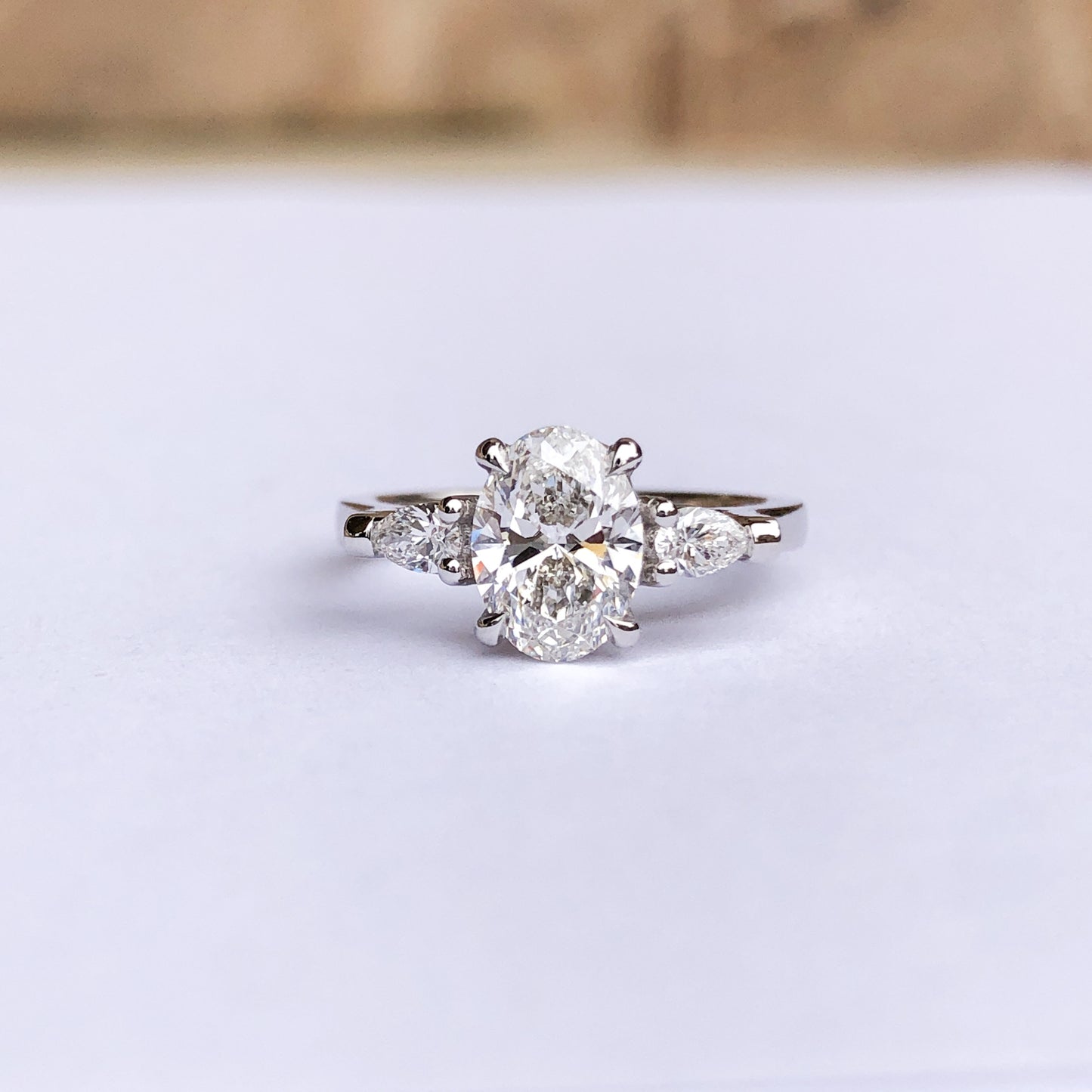 Oval and Pear Diamond Three Stone Diamond Engagement Ring