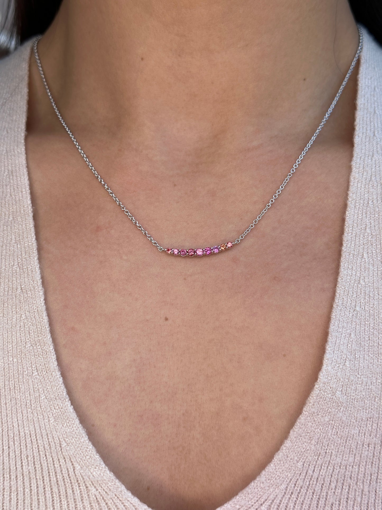 On Model: Pink Spinel Smile Crescent Necklace, Unheated Pink Spinel from Vietnam, 18K White Gold. 