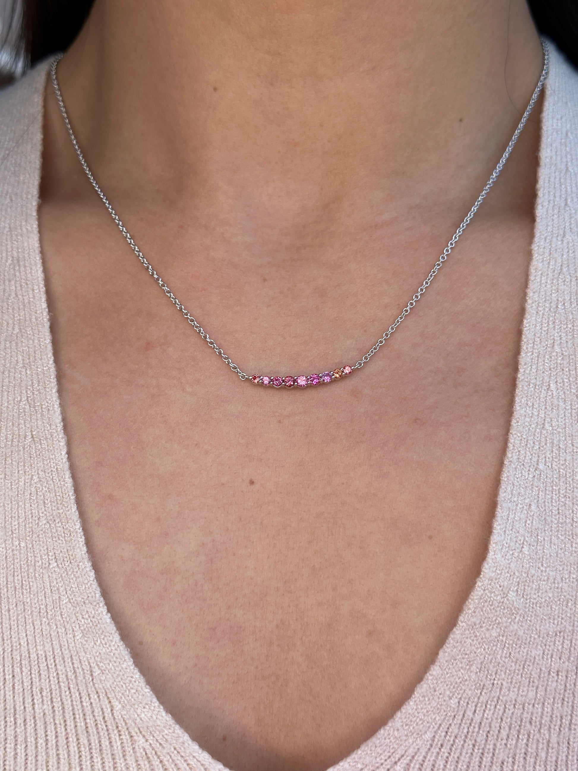 On Model: Pink Spinel Smile Crescent Necklace, Unheated Pink Spinel from Vietnam, 18K White Gold. 
