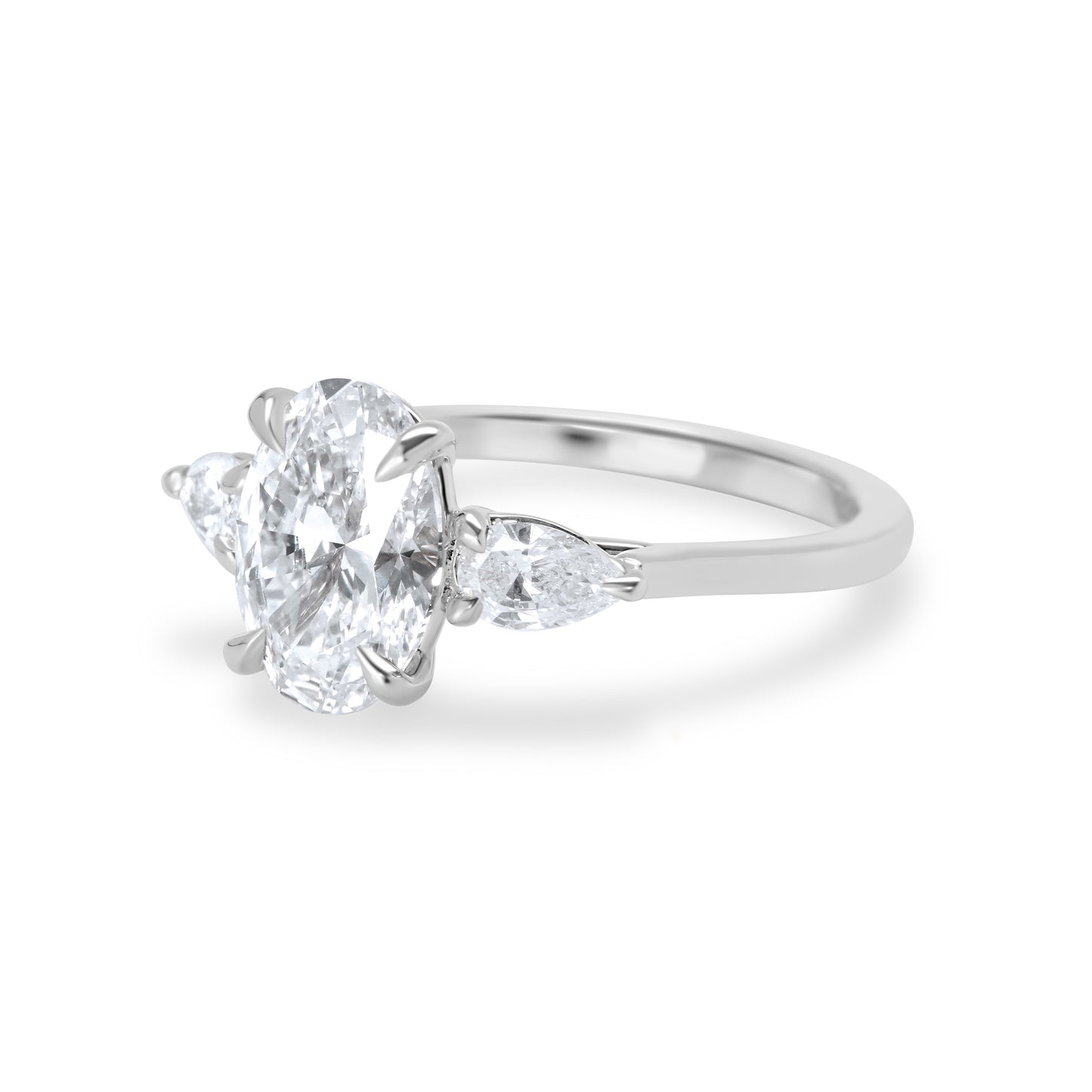 Oval and Pear Diamond Three Stone Diamond Engagement Ring