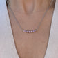 On Model: Violet Rose Sapphire Smile Crescent Necklace set with Unheated Violet Rose Sapphires from Madagascar, in 18K White Gold, SingleProng Style.
