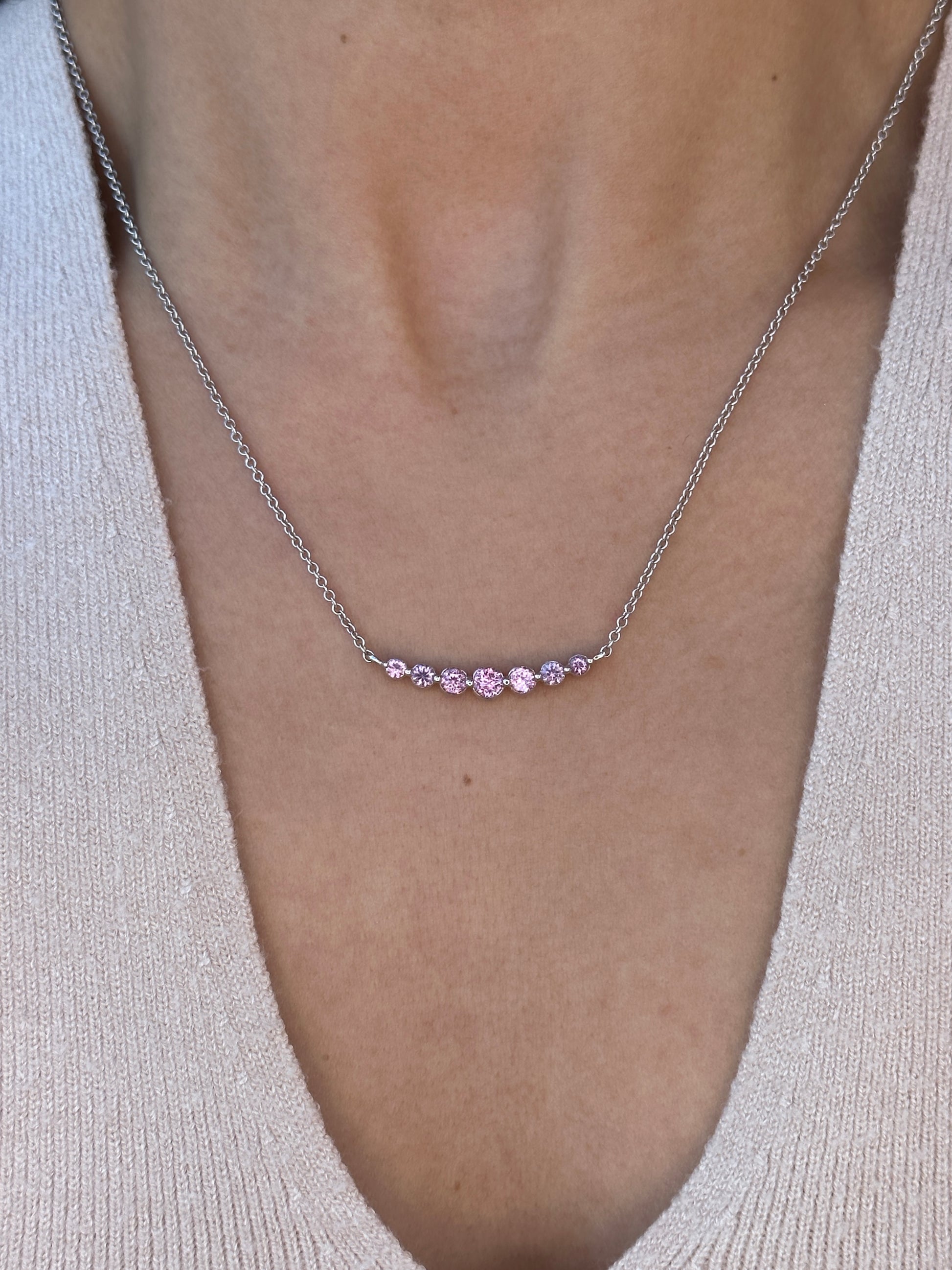 On Model: Violet Rose Sapphire Smile Crescent Necklace set with Unheated Violet Rose Sapphires from Madagascar, in 18K White Gold, SingleProng Style.